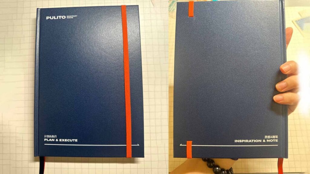 Custom notebook MOQ guide featuring a finished corporate planner with dark blue textured cover and orange elastic band